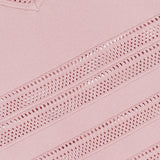 Close-up of the Taren Knit Midi Dress by L'AGENCE, showing light pink power knit fabric with diagonal open-knit mesh and solid patterns, featuring textured stitching and a ribbed edge for a subtle compression effect.
