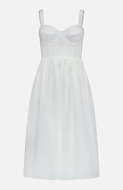 The Tiani Bustier Midi Dress by L'AGENCE is a sleeveless white linen dress with a fitted, bustier-style bodice, adjustable straps, and a flared knee-length skirt for a structured yet simple summer look.