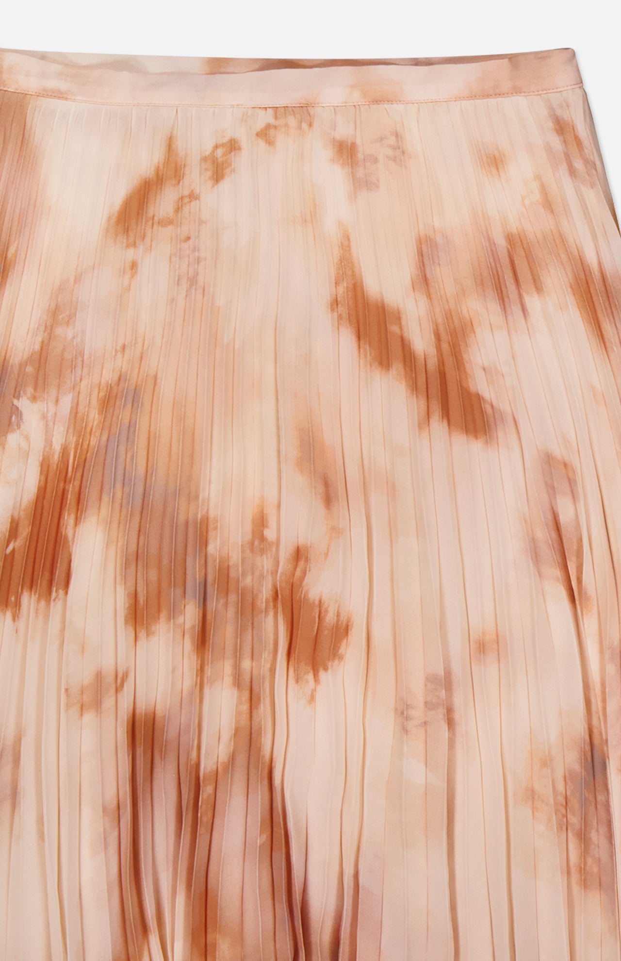 A close-up of the L'AGENCE Torin Pleated Maxi Skirt, crafted from soft, slightly glossy fabric with evenly spaced vertical pleats and a peach, beige, and light brown frappe tie-dye pattern.
