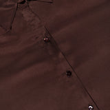 Close-up of a dark brown long-sleeve Tyler Long Sleeve Blouse by L’Agence with a pointed collar.