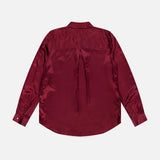 The Tyler Long Sleeve Silk Blouse by L’AGENCE, shown from the back in rich merlot red silk, features a pleat detail and shoulder yoke for an elegant silhouette.