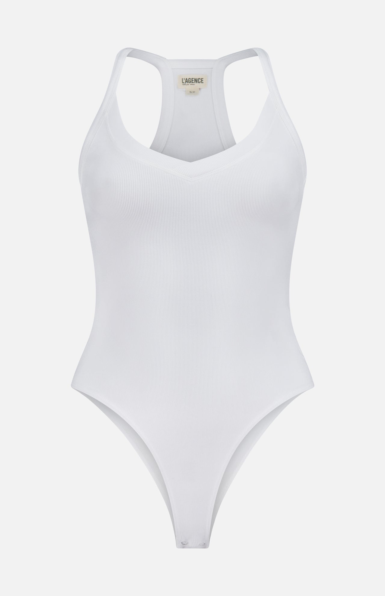 The Wrenna Racerback Bodysuit by L'AGENCE is a white fitted ribbed bodysuit with a V-neckline and racerback design, shown against a plain white background.