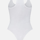 The Wrenna Racerback Bodysuit by L'AGENCE is shown from the back, featuring a plain white ribbed design with a racerback and high-cut leg openings, displayed on a white background for a sleek, fitted look.