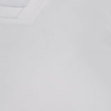 Close-up of the Wrenna Racerback Bodysuit by L'AGENCE, featuring a white hue, V-neck collar, and fine fabric texture.
