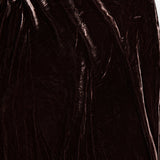 Close-up of a dark brown velvet Zeta Long Velvet Skirt in a bias-cut maxi silhouette.