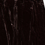 Close-up of the L’Agence Zeta Long Velvet Skirt, a bias-cut, dark brown velvet maxi skirt.