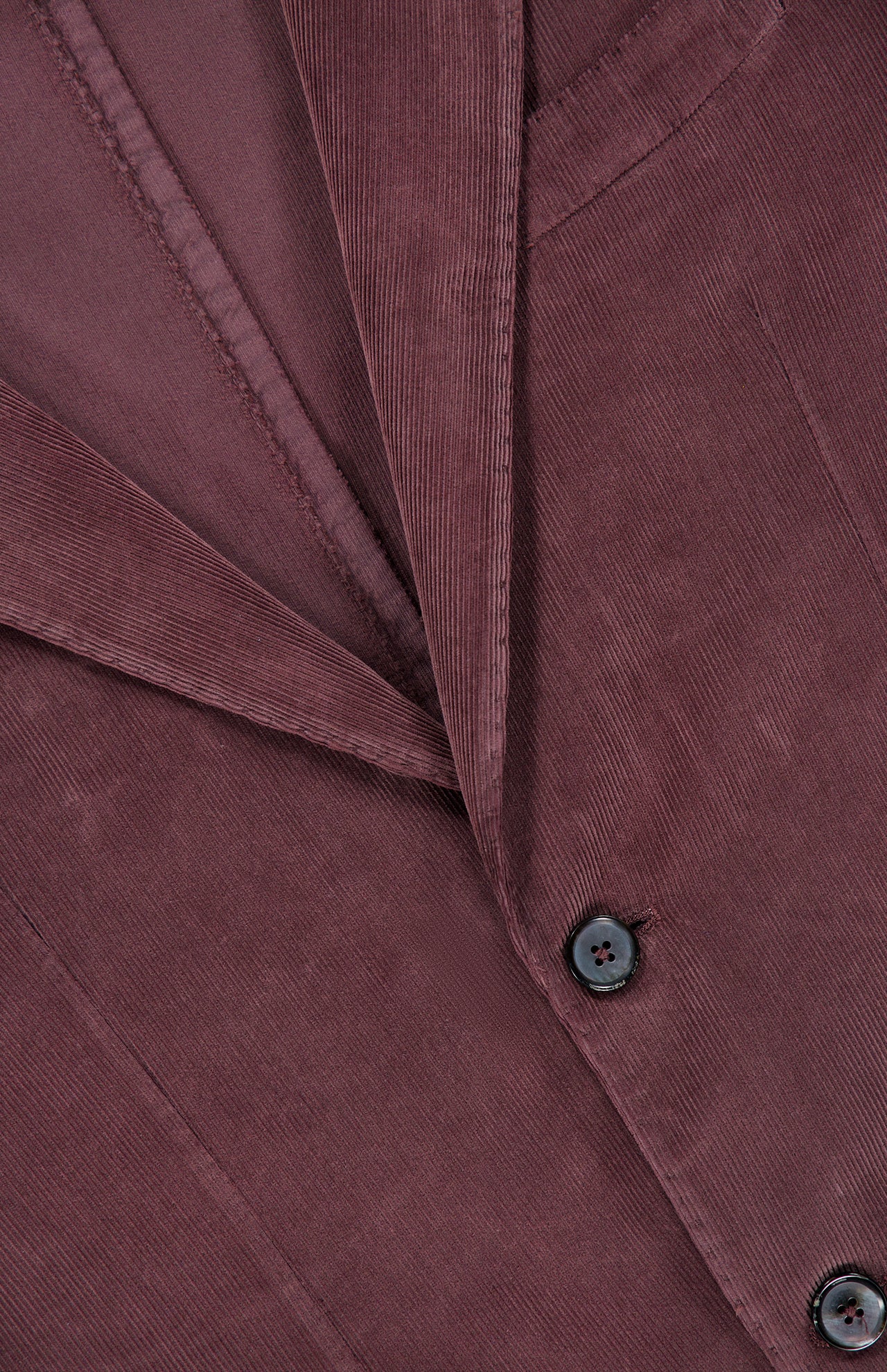 Close-up of the L.B.M. Corduroy Single Breasted Sportcoat for men, crafted in mauve corduroy—with fine ridges, a sharp lapel, part of the breast pocket, and two black buttons—highlighting the refined texture and classic detailing of this elegant sportcoat.