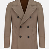 The L.B.M. Double Breasted Car Coat is a taupe wool-blend coat made in Italy, showcased on a plain white background. It features black buttons, wide lapels, flap pockets, and a smooth brown lining.