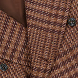 Close-up of the Glen Plaid Long Coat by L.B.M.: brown wool-blend, houndstooth pattern, black buttons, double-breasted style, and visible brown inner lining.