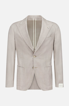 The L.B.M. Herringbone Untreated Sportcoat is a light beige men's blazer, crafted in Italy from a wool-silk-linen blend with notched lapels, two buttons, patch pockets, and a white label on the left cuff, shown on a plain white background.