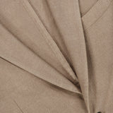 Close-up of the L.B.M. Solid 2 Button Sportcoat in beige wool cashmere, made in Italy, highlighting the lapel, pocket, and one of the brown buttons. The fine texture of the fabric is visible, showcasing the sportcoat’s precise tailoring.