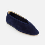 The Luna Suede Slipper Flat by LE MONDE BERYL is a dark blue Italian-made suede slip-on with a slightly pointed toe, low-cut vamp, and beige interior, shown against a white background.