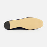 The image features the sole of the Luna Suede Slipper Flat by LE MONDE BERYL, crafted in Italy, showing a beige leather bottom and black heel, set against a plain white background.