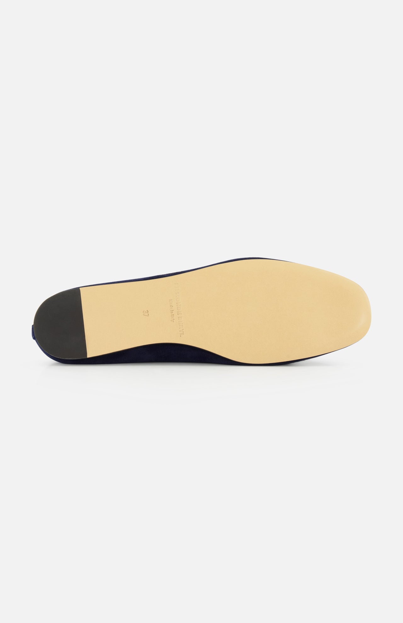 The image features the sole of the Luna Suede Slipper Flat by LE MONDE BERYL, crafted in Italy, showing a beige leather bottom and black heel, set against a plain white background.