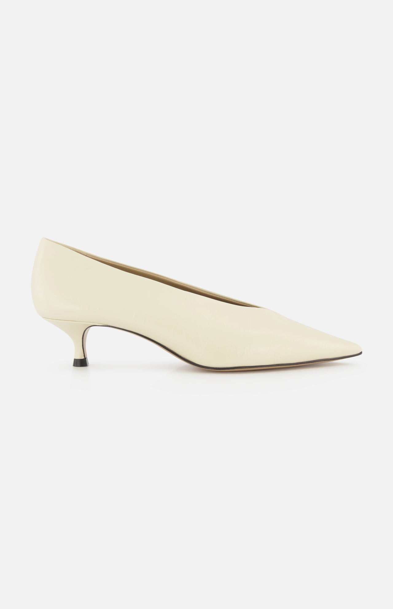 The Babouche Leather Kitten Heel by LE MONDE BERYL is shown in side view, featuring an off-white leather pointed toe and slender low profile, set against a plain white background.