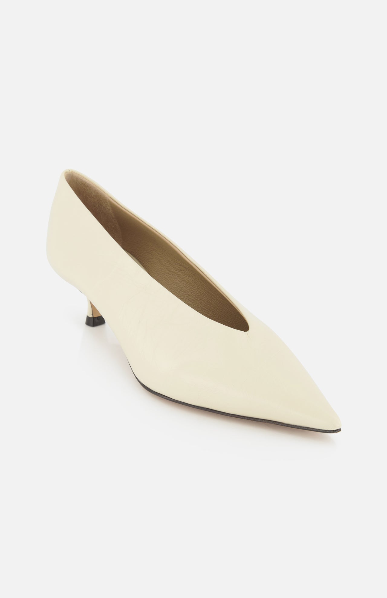 The Babouche Leather Kitten Heel by LE MONDE BERYL is a single off-white pointed toe pump with a low kitten heel, shown on a white background.