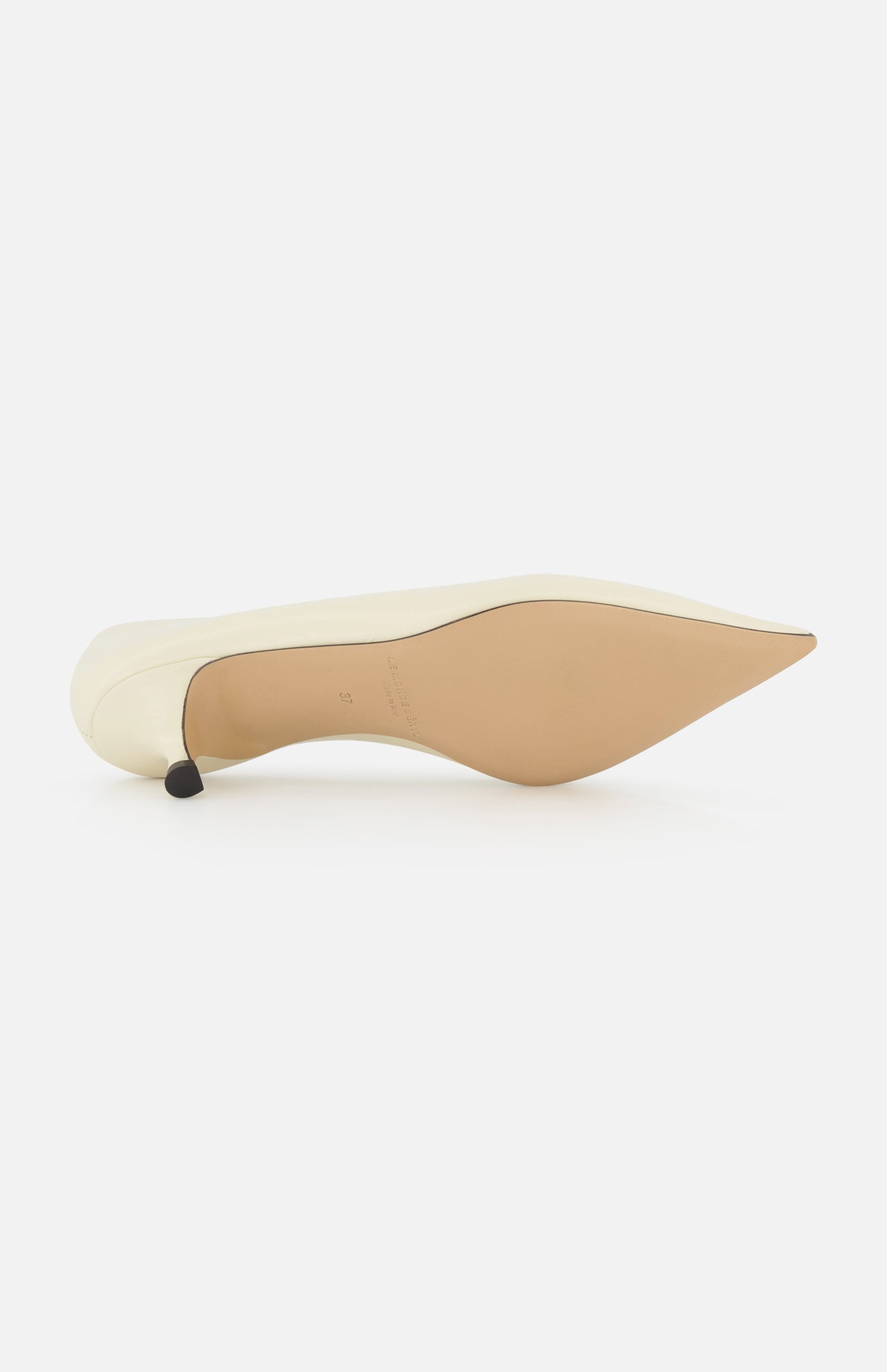 The LE MONDE BERYL Babouche Leather Kitten Heel, featuring a white leather pointed toe and smooth beige sole, lies on its side to showcase its elegant silhouette against a plain white background.