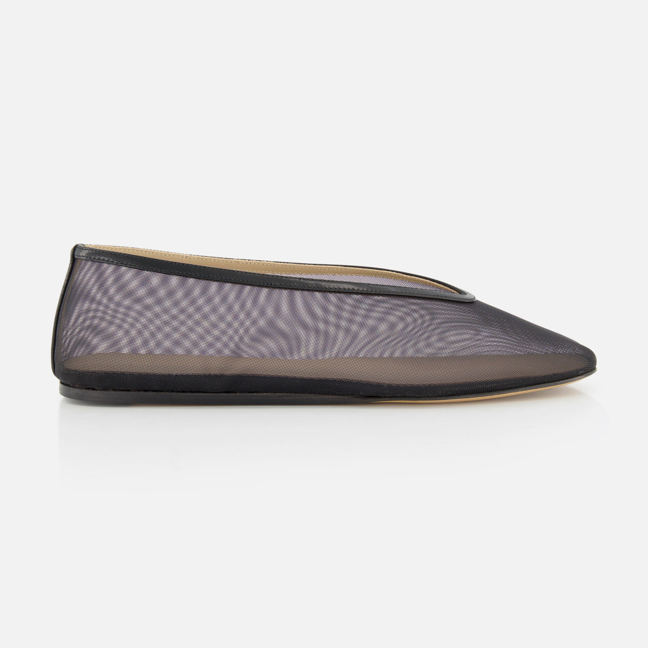 The Luna Mesh Slipper by LE MONDE BERYL is a sheer black mesh flat with a pointed toe, thin black trim, and cushioned calf leather insole, handcrafted in Italy and shown in profile against a plain white background.