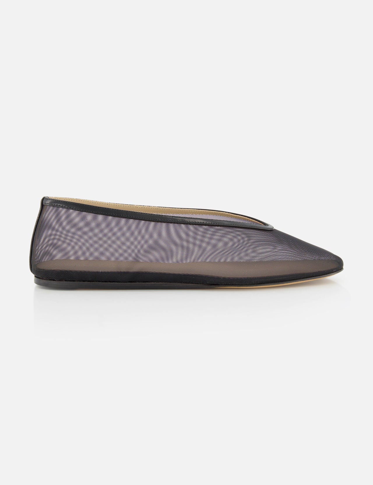 The Luna Mesh Slipper by LE MONDE BERYL is a sheer black mesh flat with a pointed toe, thin black trim, and cushioned calf leather insole, handcrafted in Italy and shown in profile against a plain white background.