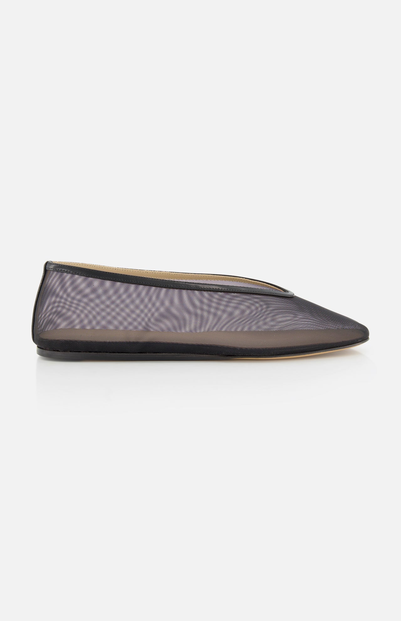 The Luna Mesh Slipper by LE MONDE BERYL is a sheer black mesh flat with a pointed toe, thin black trim, and cushioned calf leather insole, handcrafted in Italy and shown in profile against a plain white background.