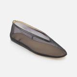 The Luna Mesh Slipper by LE MONDE BERYL is a single black mesh flat with a rounded toe, thin black sole, and cushioned calf leather insole. Semi-transparent and handcrafted in Italy, it's pictured on a white background.