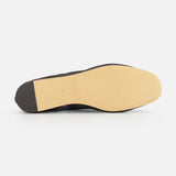 The image shows the underside of the Luna Mesh Slipper by LE MONDE BERYL, featuring a light tan leather sole, dark heel, and cushioned calf leather insole, displayed on a white background.