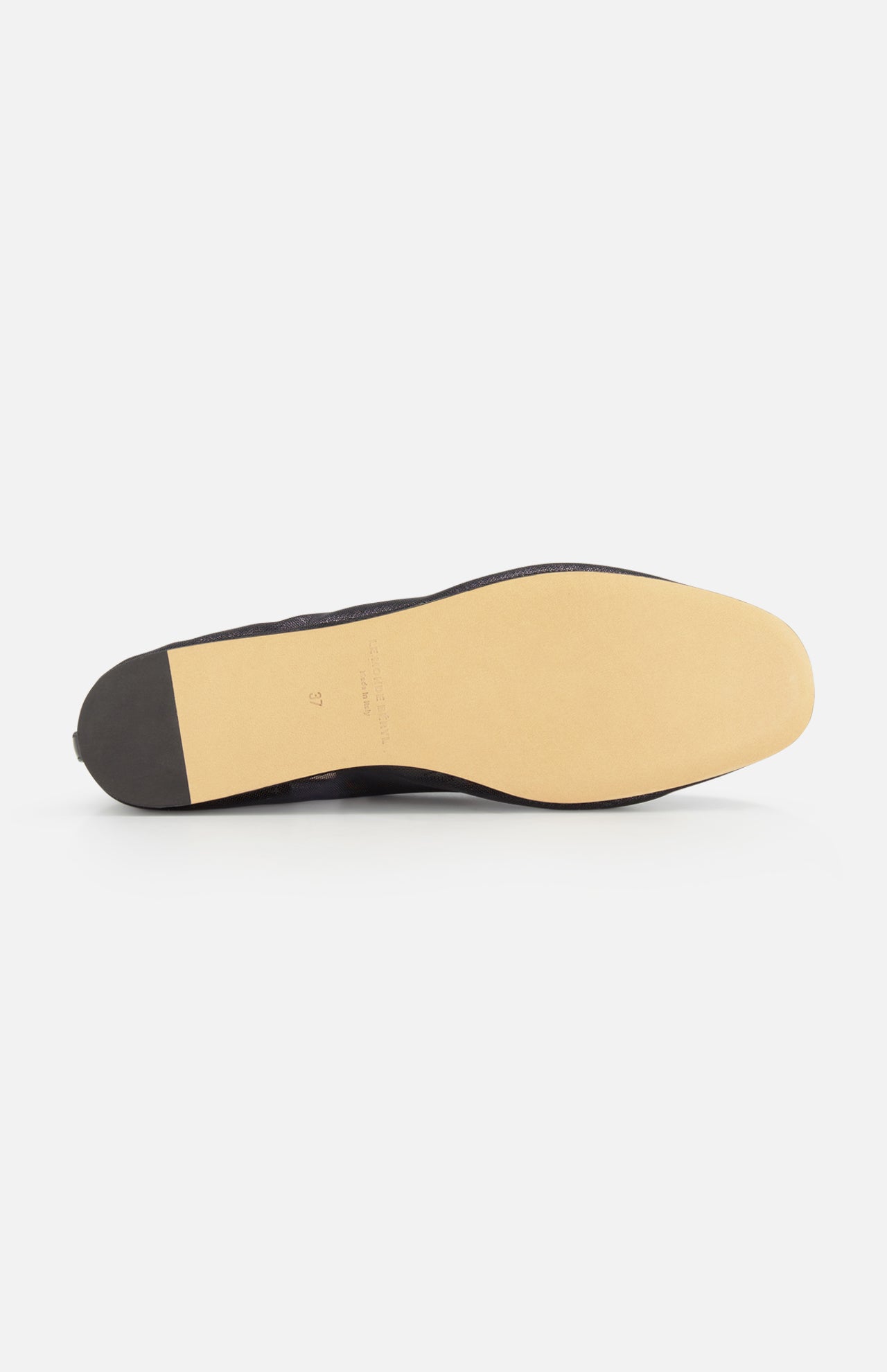 The image shows the underside of the Luna Mesh Slipper by LE MONDE BERYL, featuring a light tan leather sole, dark heel, and cushioned calf leather insole, displayed on a white background.