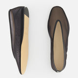 The Luna Mesh Slipper by LE MONDE BERYL features black mesh, cushioned calf leather insoles, and beige soles. Handcrafted in Italy, they're showcased from top and bottom views on a white background.