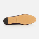 The underside of a handcrafted, dark purple Luna Leather Slipper Flat by Le Monde Béryl, featuring a flat sole and a small block heel.