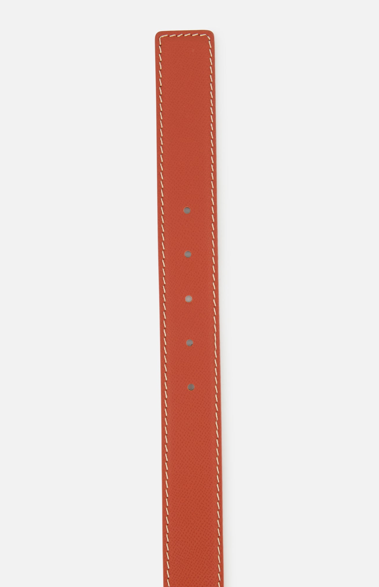 The LEN Belts Epsom Belt is a burnt orange European leather strap featuring white contrast stitching and five adjustment holes.