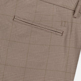 Close-up of LES DEUX Como Reg Houndstooth Suit Pants in light brown, highlighting the back pocket with a subtle houndstooth pattern and belt loop. These straight fit pants offer a refined twist on classic design.
