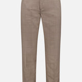 The LES DEUX Como Reg Houndstooth Suit Pants feature a light brown houndstooth print, slim fit, belt loops, button and zipper closure, and front pockets, shown against a white background.
