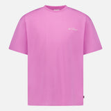 The LES DEUX Crew Neck Logo T-shirt is a bright pink, short-sleeved tee featuring a small white script logo on the left chest, ideal for casual wear and shown against a white background.
