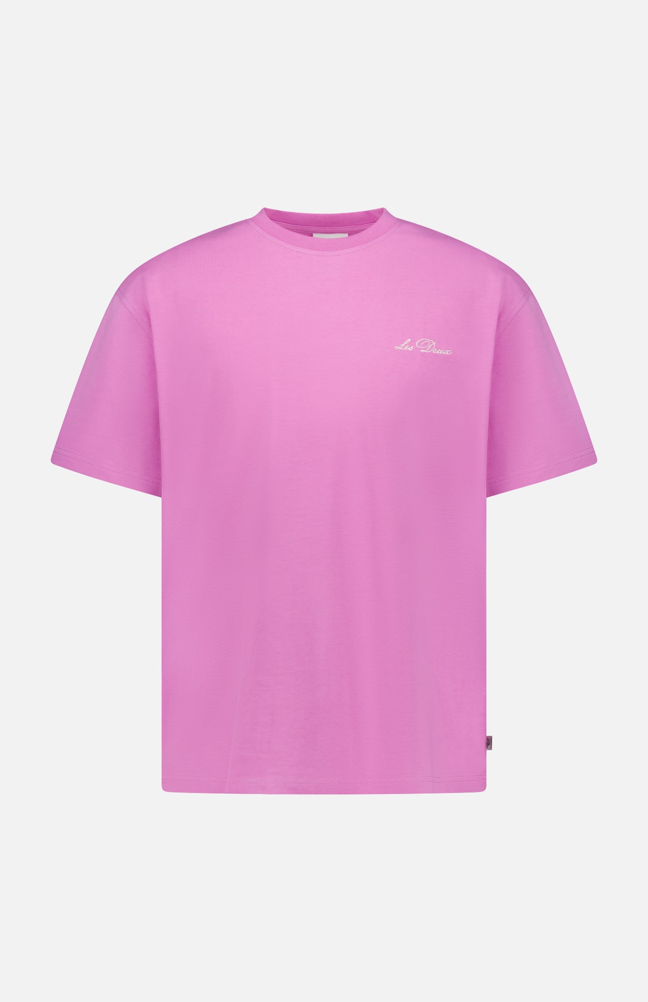 The LES DEUX Crew Neck Logo T-shirt is a bright pink, short-sleeved tee featuring a small white script logo on the left chest, ideal for casual wear and shown against a white background.