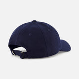 The LES DEUX Felt Logo Dad Cap is displayed from the back, highlighting its navy blue color, curved brim, and adjustable strap with a metal buckle. The background is plain and light gray.