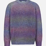 The LES DEUX Gradient Roundneck Knit Sweater is a thick knit design with long sleeves and a crew neckline, showcasing a gradient dyed pattern in spiced plum, blue, and green tones.