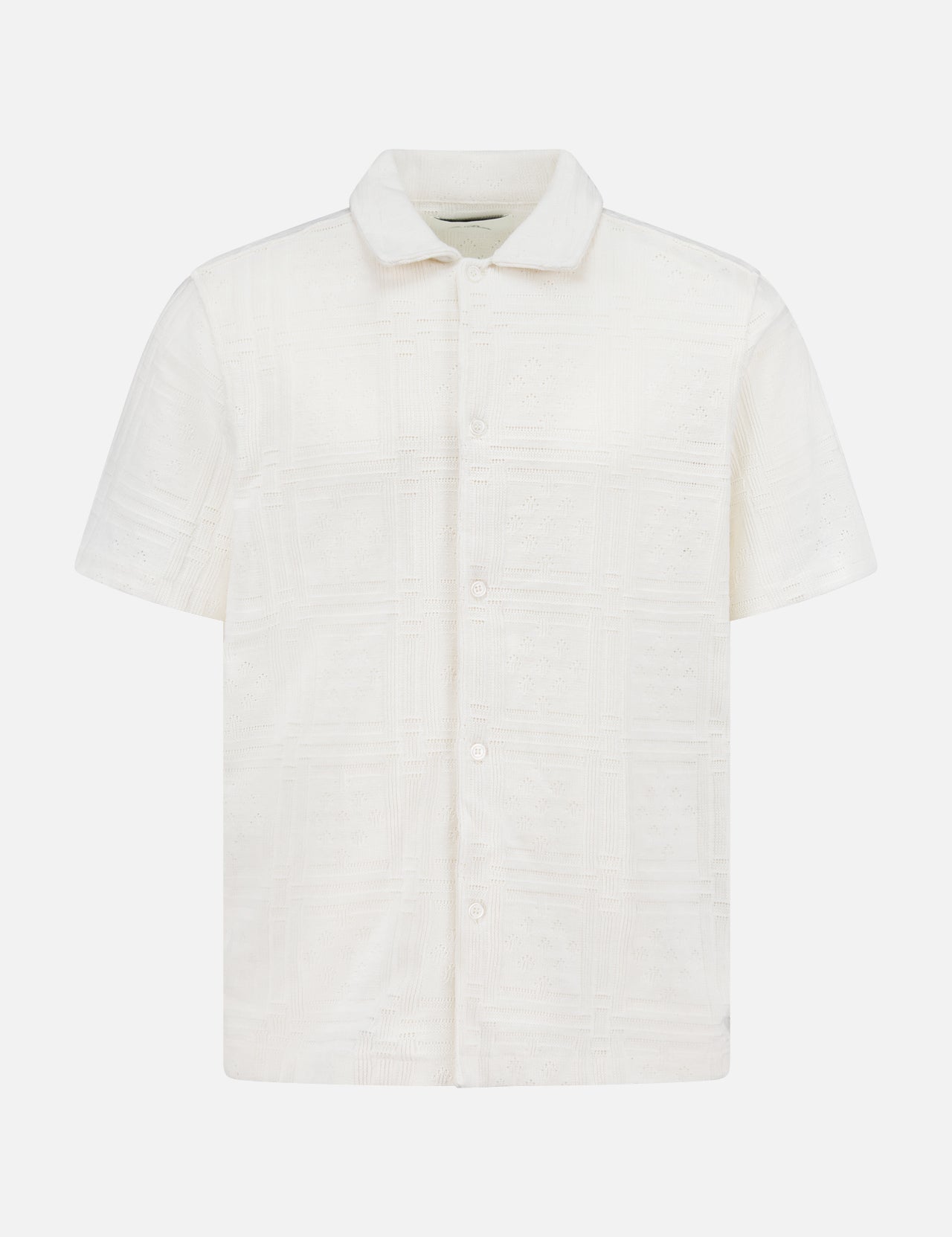 The LES DEUX Hector Pointelle Short Sleeve Shirt features an off-white fabric with a subtle square pattern, short sleeves, a button-up front with Mother of Pearl buttons, displayed on a plain white background.
