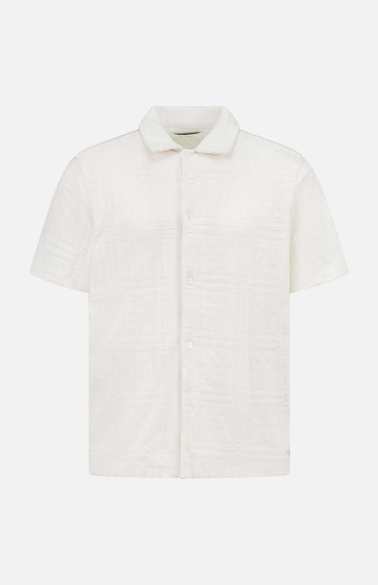 The LES DEUX Hector Pointelle Short Sleeve Shirt features an off-white fabric with a subtle square pattern, short sleeves, a button-up front with Mother of Pearl buttons, displayed on a plain white background.