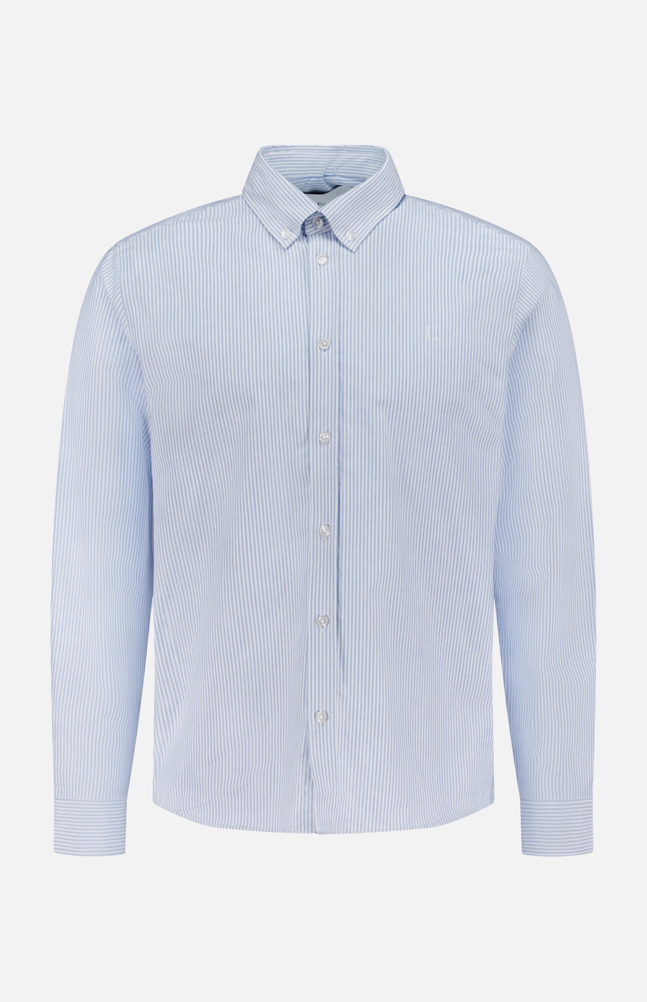 The LES DEUX Konrad Striped Oxford Shirt features light blue and white vertical stripes, long sleeves, and a classic collar, shown against a plain white background.