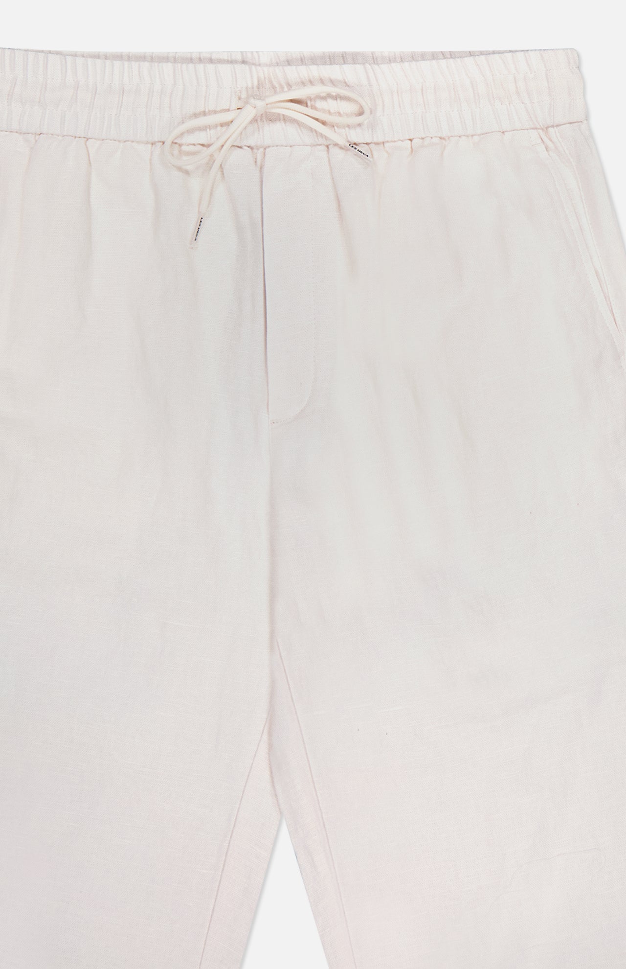 A close-up of the LES DEUX Patrick Linen-blend Pants, showcasing their breathable fabric, elastic drawstring waist, side pockets, and relaxed fit in light beige.