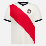 The LES DEUX USA Football Jersey is a white short-sleeve shirt with a bold red diagonal stripe, blue V-neck collar and sleeve trim, plus a club crest with red and white stripes on the left chest.