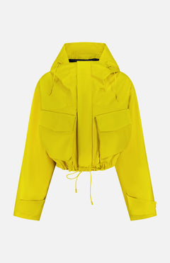The Lined Bomber Jacket by RALPH LAUREN COLLECTION is a bright yellow, cropped leather jacket with long sleeves, oversized front flap pockets, a hood with drawstrings, and an adjustable tie waist, shown against a plain white background.