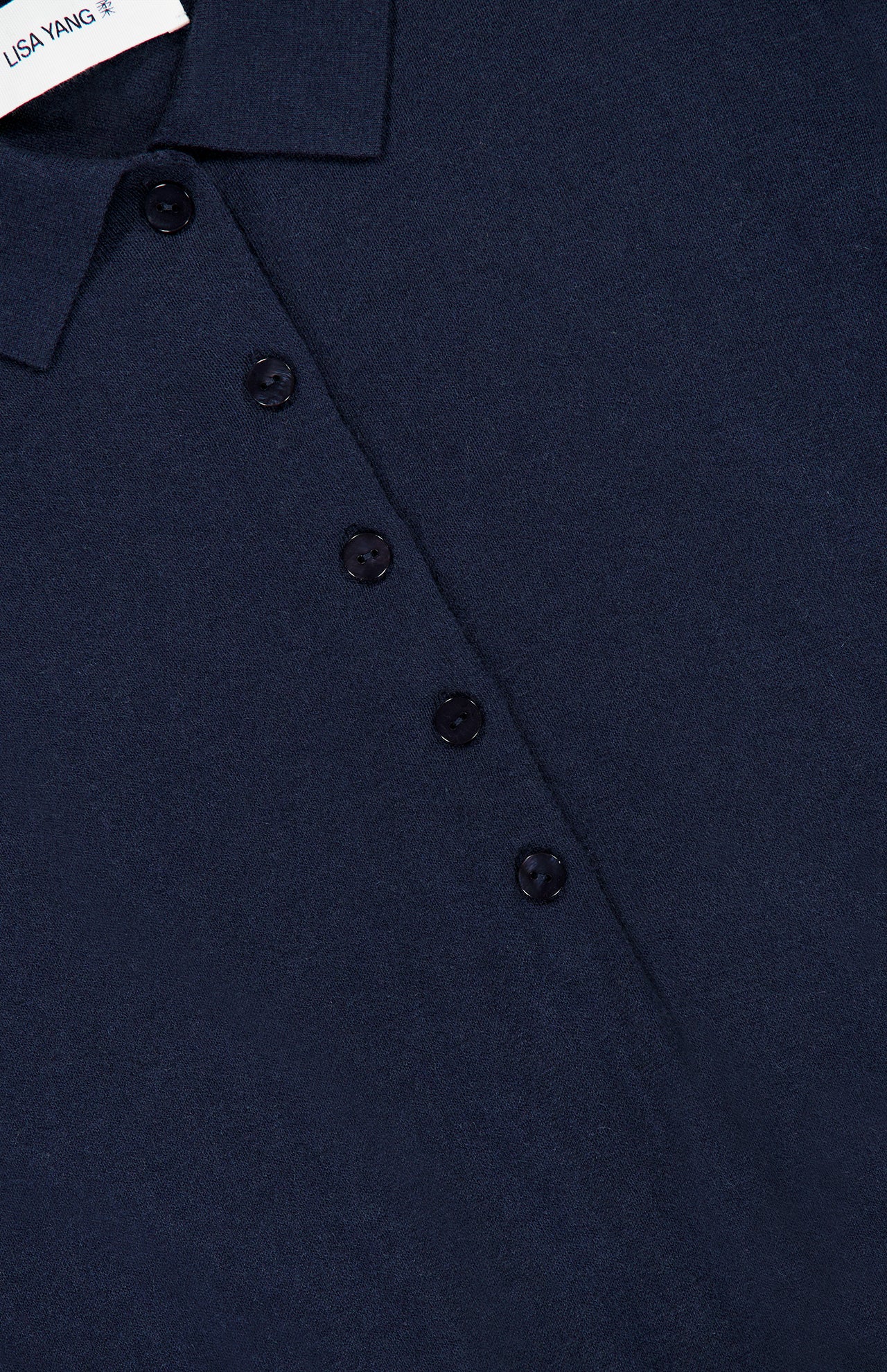 Close-up of the Anthea Twist-front Midi Dress by LISA YANG in navy, featuring refined collared detailing, a four-button front, and a visible brand label at the neckline—embodying sophisticated elegance.