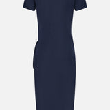 The back view showcases the LISA YANG Anthea Twist-front Midi Dress in navy—a short-sleeved, knee-length piece with a simple, fitted silhouette and no visible patterns or embellishments, ideal for anyone drawn to the timeless elegance of a classic navy midi dress.