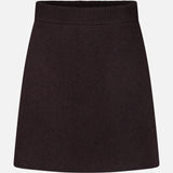 The Clare Cashmere Mini Skirt by LISA YANG is a plain black mini skirt featuring a ribbed elastic waistband, crafted from heavy knit cashmere and displayed against a white background—an understated staple from the slow luxury brand.