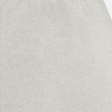 Close-up of the ribbed, light gray waistband on the LISA YANG Dolly Cashmere Maxi Skirt, showcasing its soft cashmere fabric, smooth texture, and neutral hue.