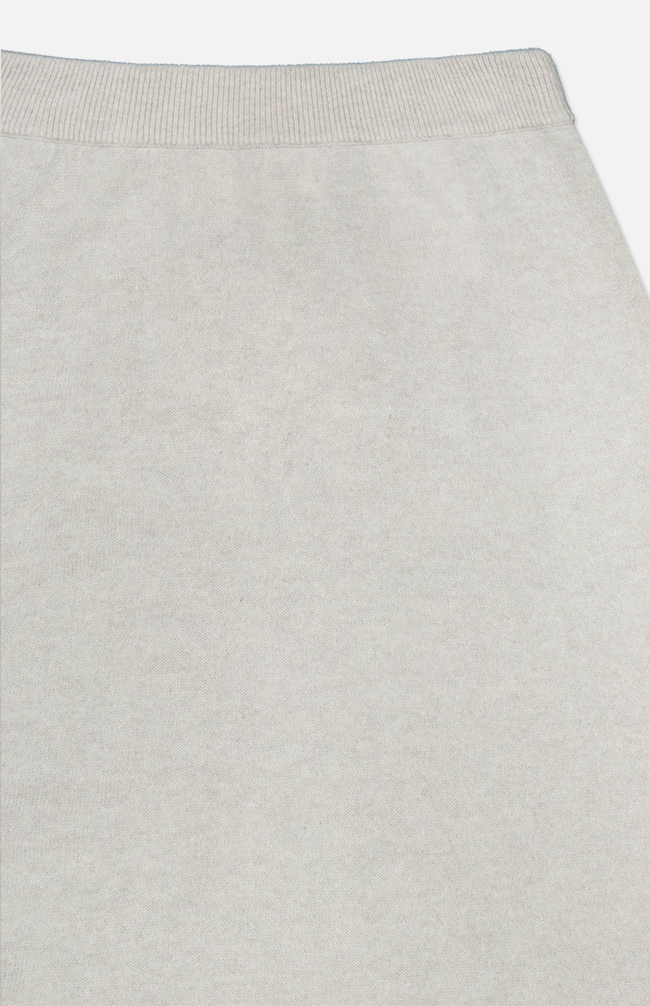 Close-up of the ribbed, light gray waistband on the LISA YANG Dolly Cashmere Maxi Skirt, showcasing its soft cashmere fabric, smooth texture, and neutral hue.