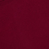 Close-up of the Hally Cashmere Sweater in burgundy, featuring a ribbed crew neckline and a small white LISA YANG label sewn inside the collar, exemplifying slow luxury craftsmanship in pure cashmere.