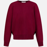 The LISA YANG Hally Cashmere Sweater is a plain, long-sleeved crew neck style in a rich burgundy hue, exemplifying slow luxury and shown against a white background.