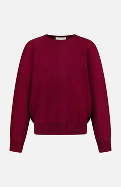 The LISA YANG Hally Cashmere Sweater is a plain, long-sleeved crew neck style in a rich burgundy hue, exemplifying slow luxury and shown against a white background.